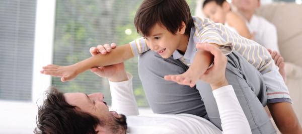Image of a man holding a small child